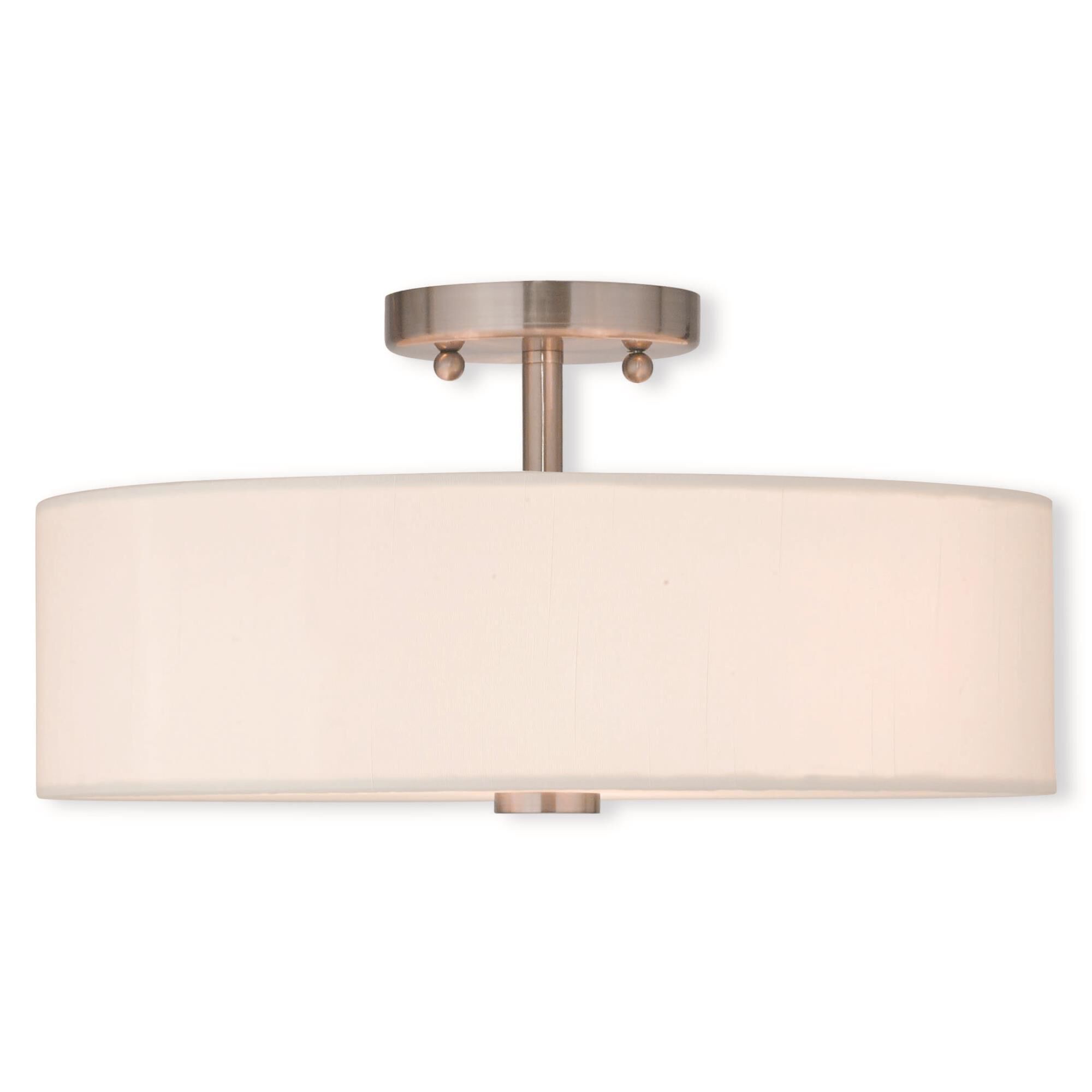 Shown in Brushed Nickel finish and Hand Crafted Off-White Fabric Hardback shade